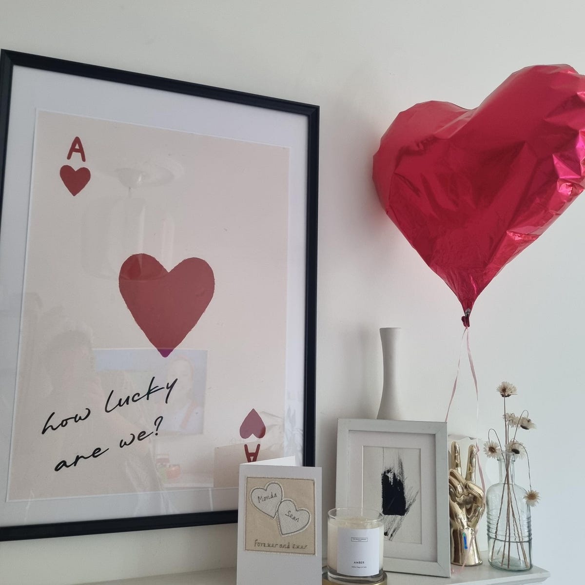 The Perfect Pair wall art above nightstand in stylish bedroom