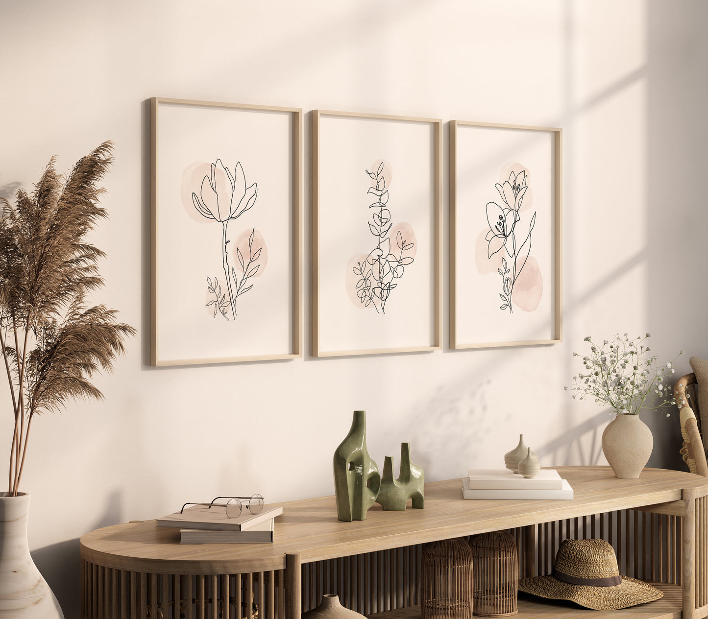 Three-piece wall art set with delicate floral line drawings