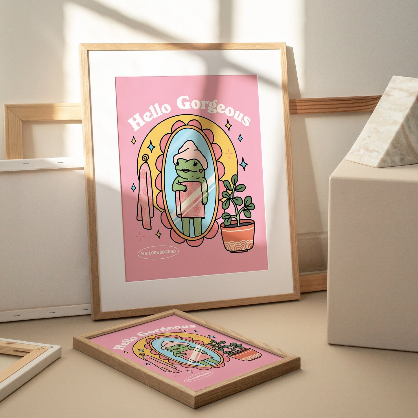 Unframed wall print with bold pink typography and frog motif