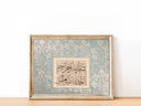 Surah Al-Fatiha verse on decorative Islamic wall art with traditional borders