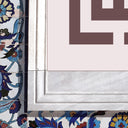 Ornate borders surrounding Arabic calligraphy in Islamic art