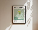 Flat lay of Hugo Spritz print with oranges and herbs