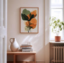 Two botanical art prints displayed together on a living room wall