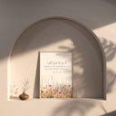 Framed Islamic wall art with Quran 13:28 and floral accents