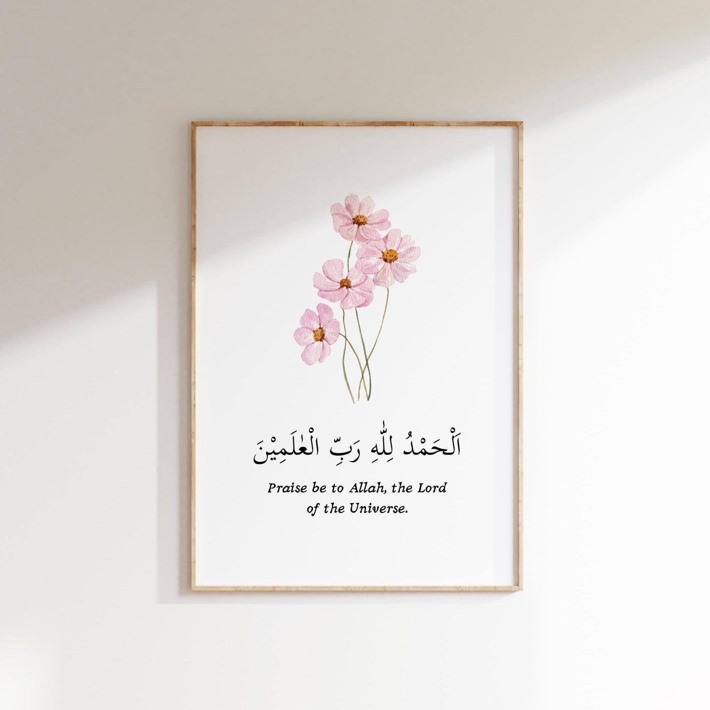 Framed pink Islamic wall art in a modern living room