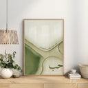 Three framed posters arranged on living room wall as decor