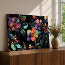 Framed floral wall art on canvas showing pink blossoms with neon accents