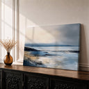 Framed seascape wall art on a light wood frame with blue ocean tones