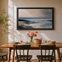 Seaside artwork featuring waves and horizon in blues