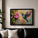 Framed hummingbird art with lush green leaves and blue accents